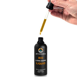 AYUVANA Bio Lions Mane Liquid - Ein Tropfen fällt aus der Pippette in das Glas